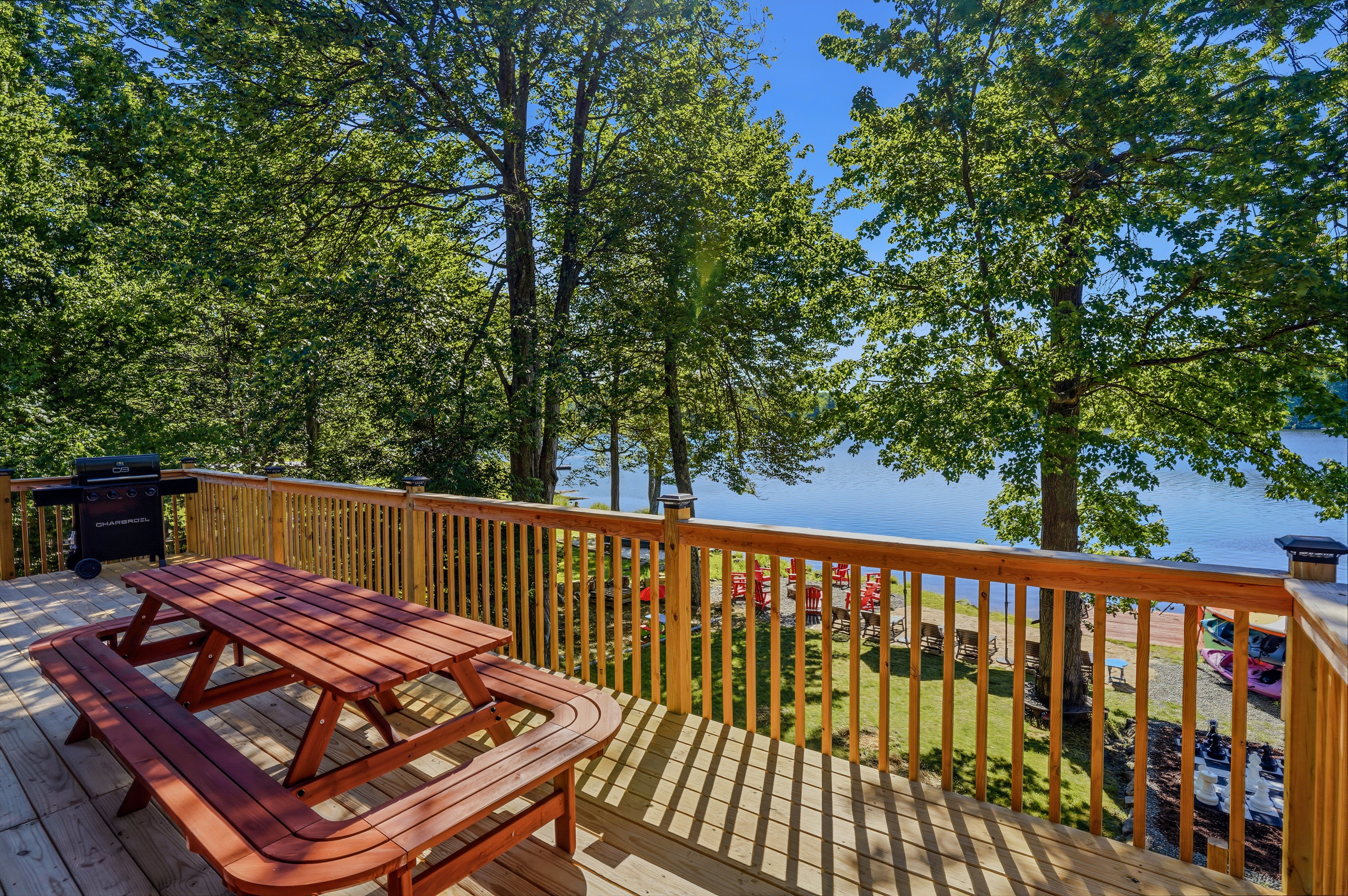 Upper deck with picnic table and open lake views — morning coffee never looked this good