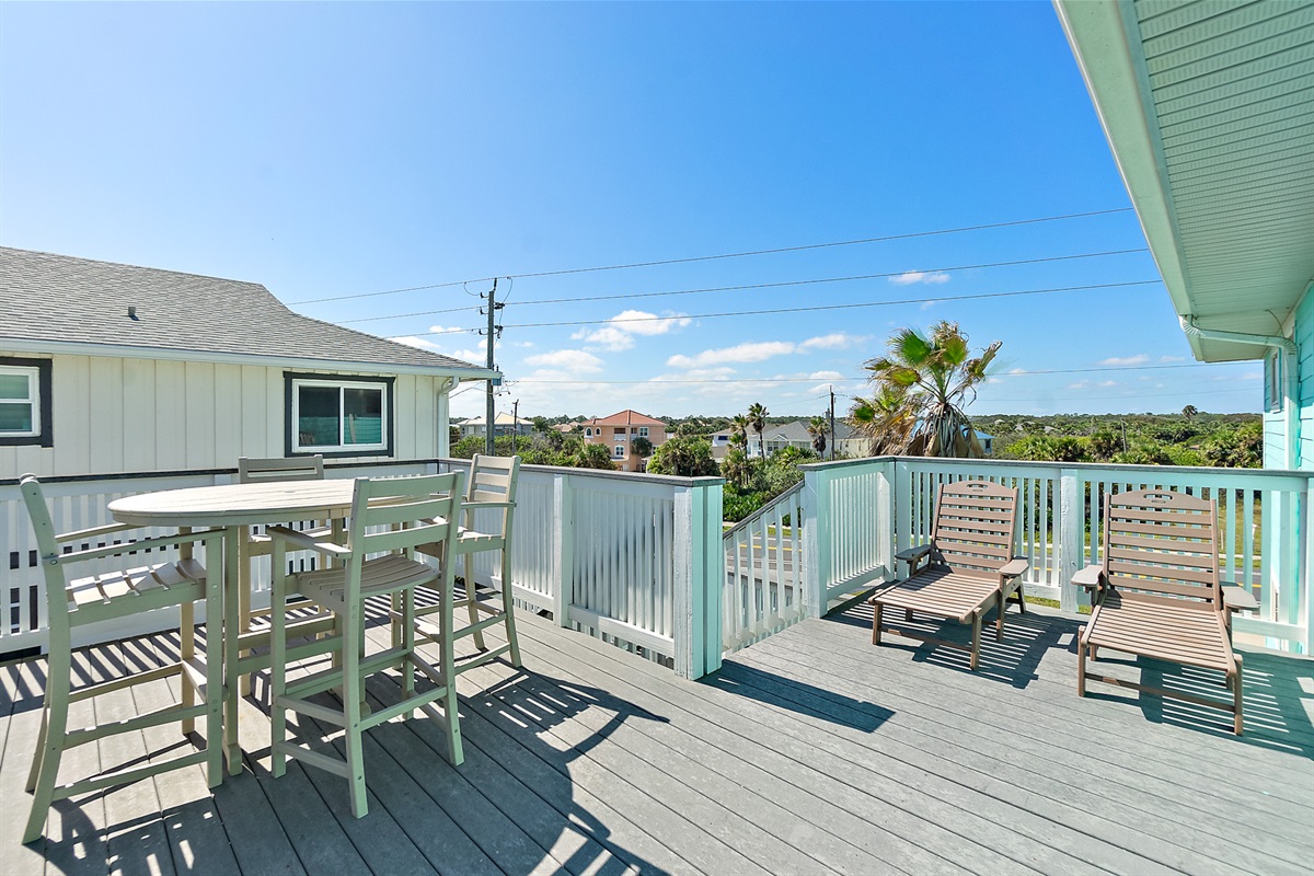 Lounge chairs and coastal breezes on the deck