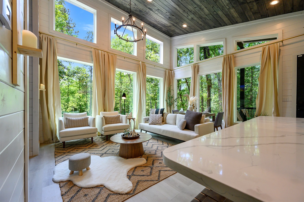 Sunlit spaces with peaceful nature views, stylish seating, and a warm, welcoming vibe are waiting for you at this beautiful retreat. Come stay with us!