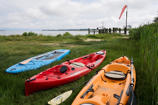 Kayaks and paddleboards provided for guest use