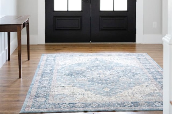 Welcome! Our large double front doors open toward the grand staircase and open living room/kitchen area, with the library/music room on the right when you enter.