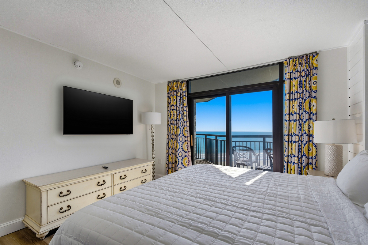 Bedroom with TV and ocean view