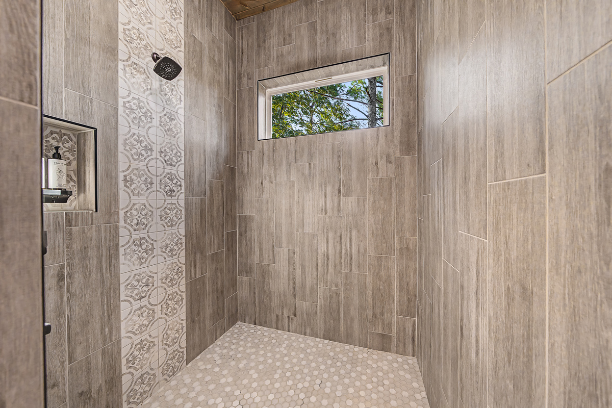 Spacious rain showers bring a little boutique-hotel luxury to the treehouse experience.
