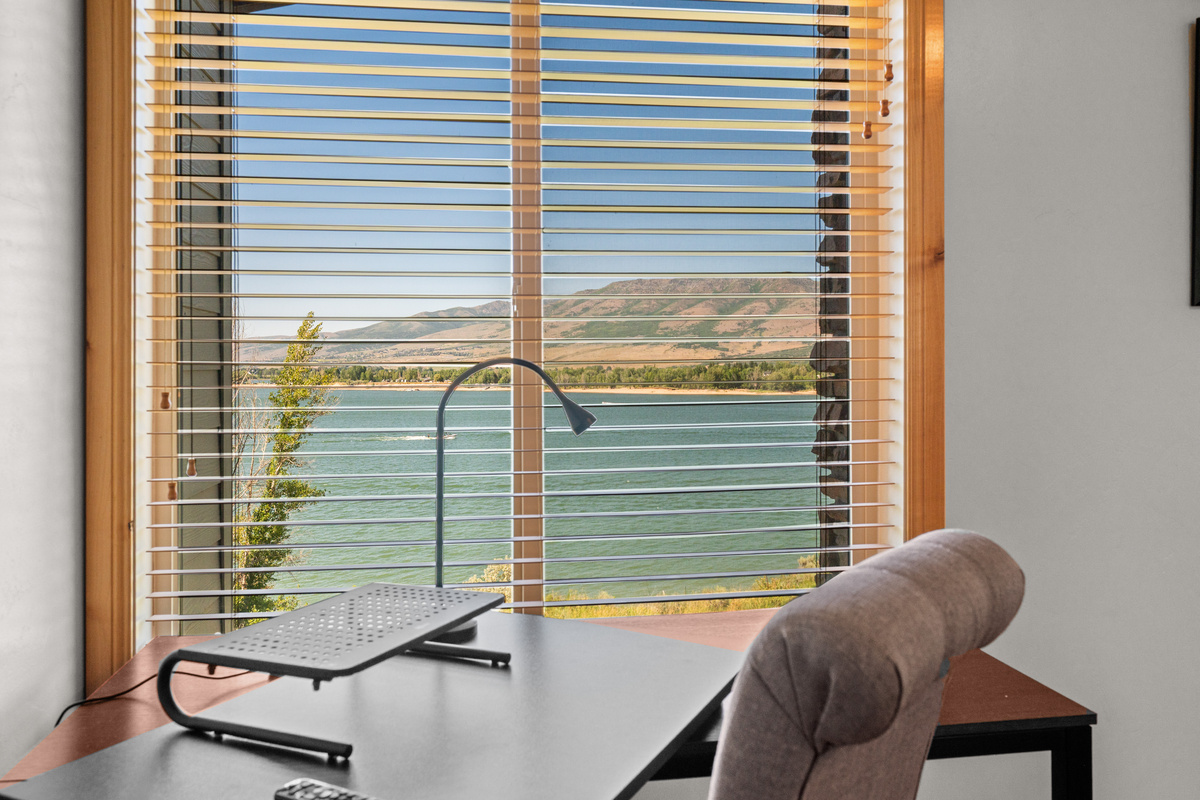 Desk with inspiring views of Pineview Reservoir for remote work or trip planning.