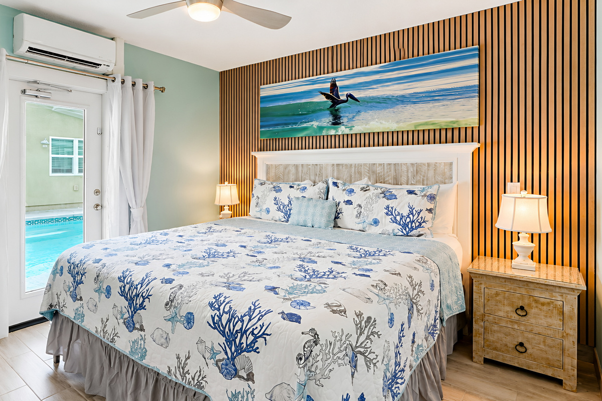 Master Bedroom of Pelican Suite with direct Pool Access  at AMI Beach Lagoon
