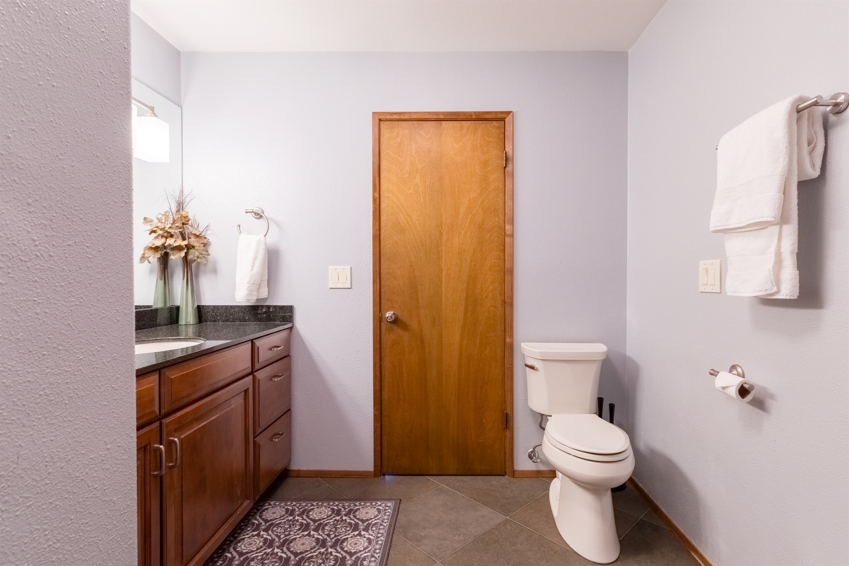 Guest bathroom, located near the guest bedrooms with large walk-in shower.