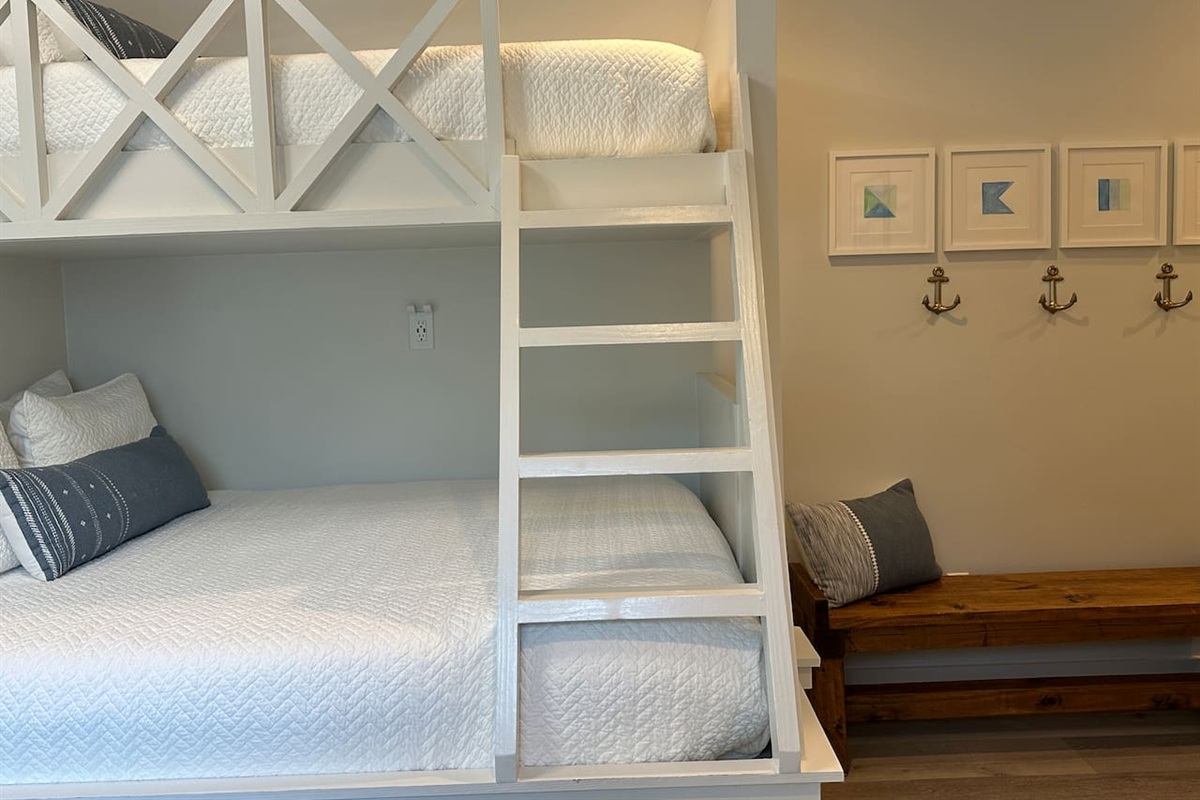 Spacious 2nd level twins over queens bunk room with full ensuite bathroom, tiled shower with tub, and a large vanity.