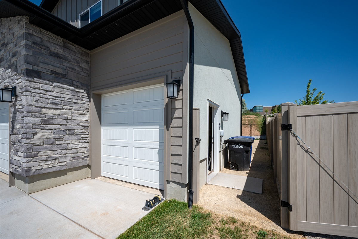 Enter the downstairs unit via the attached one-car garage or use the private side door—both options offer easy and secure access.