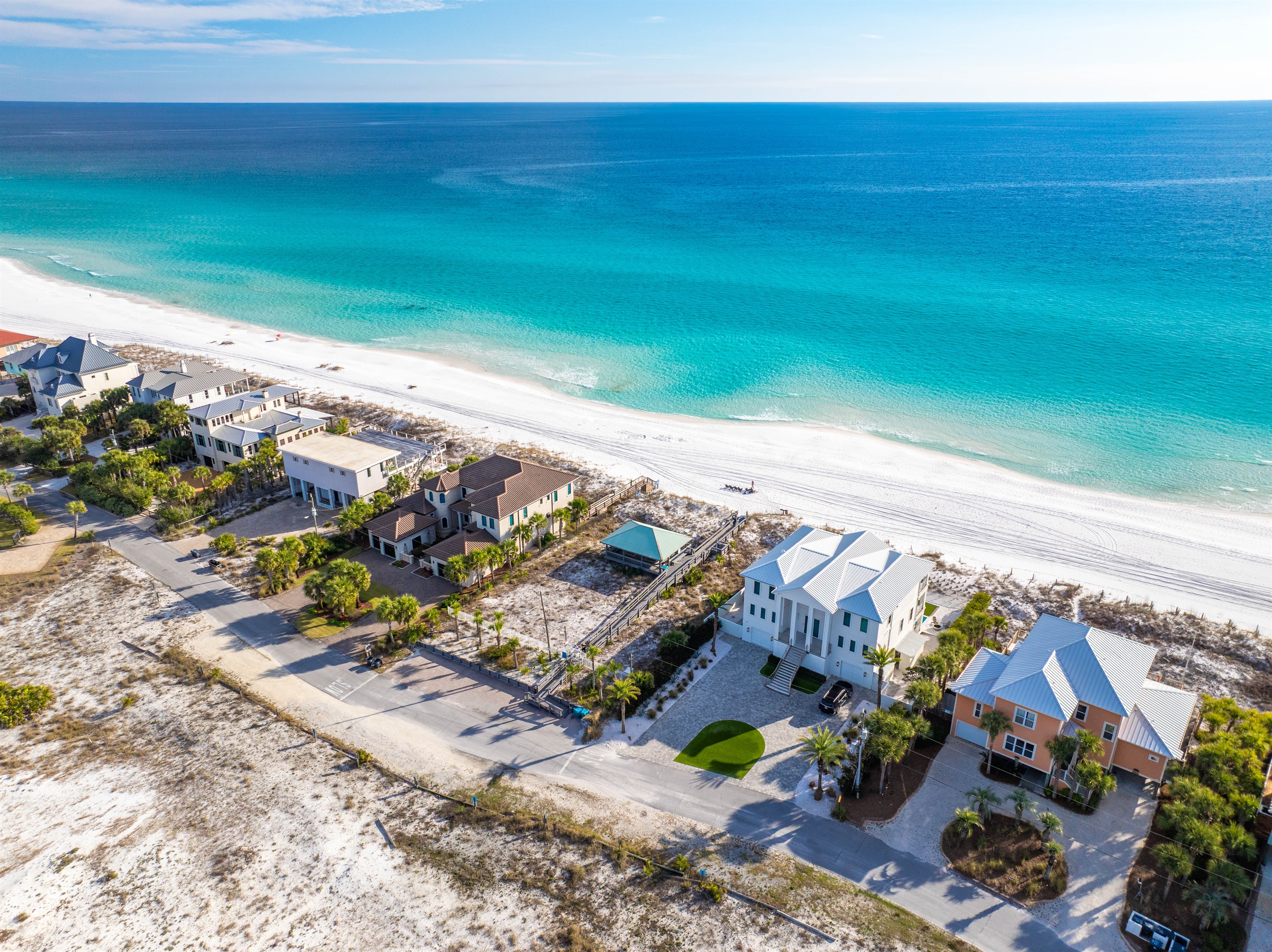Golf cart and vehicle parking at your private beach access point.