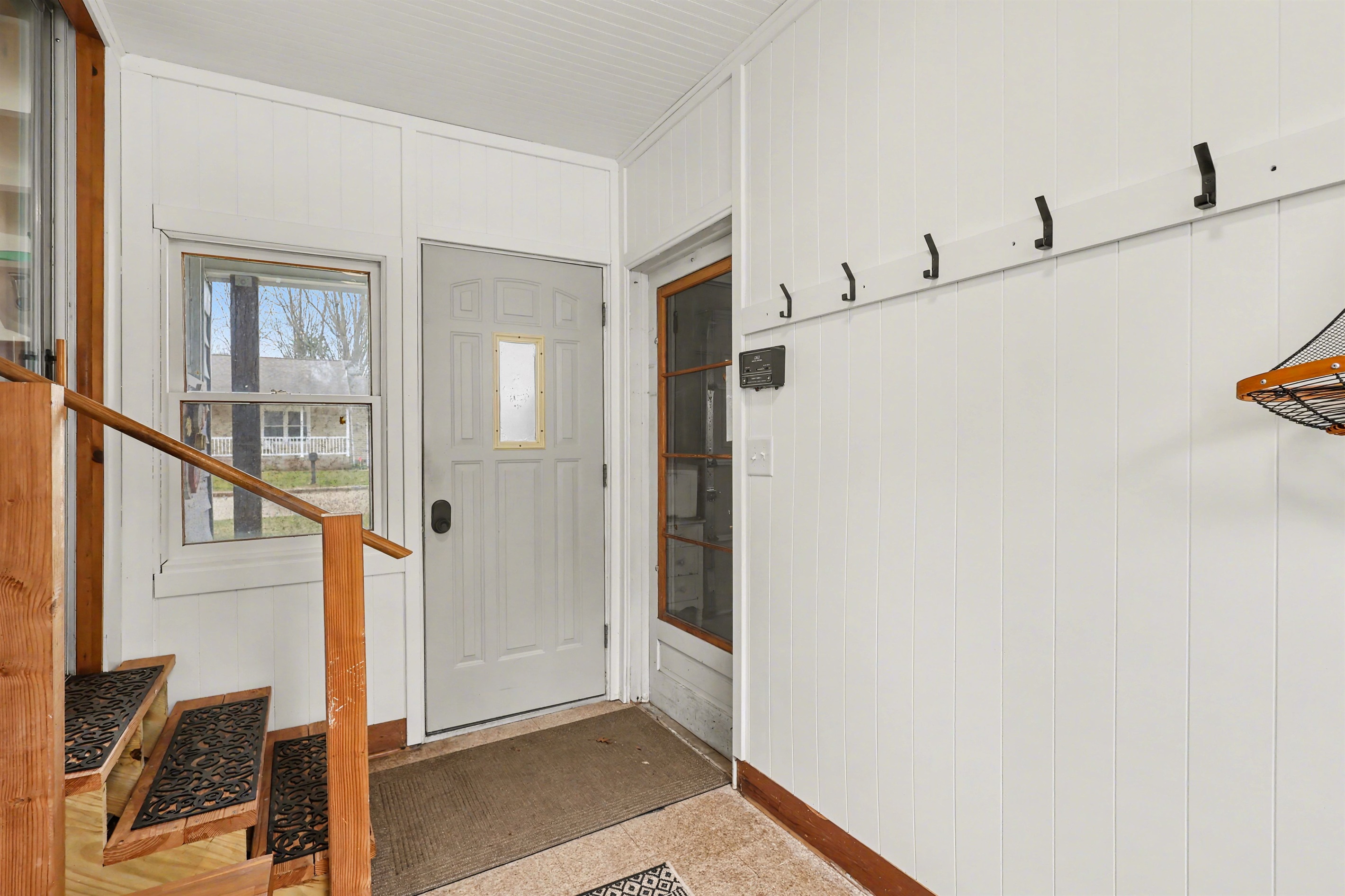 Entry door and steps into home from breezeway.