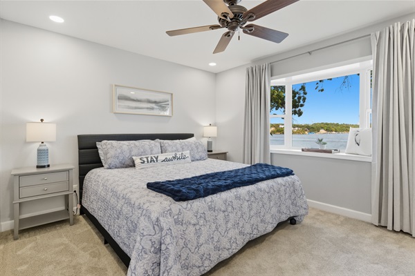 Wake up to beautiful lake views from the king bedroom