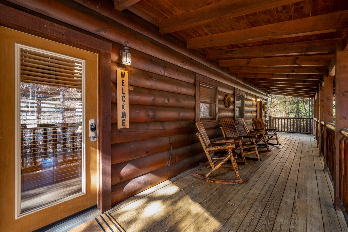 Unwind on the covered deck with classic rocking chairs; the perfect spot to sip your morning coffee or relax in the evening, all just steps from the front entry.