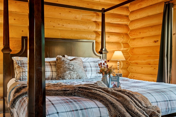 Spacious master suite featuring a king bed, TV, dresser, and private bath.