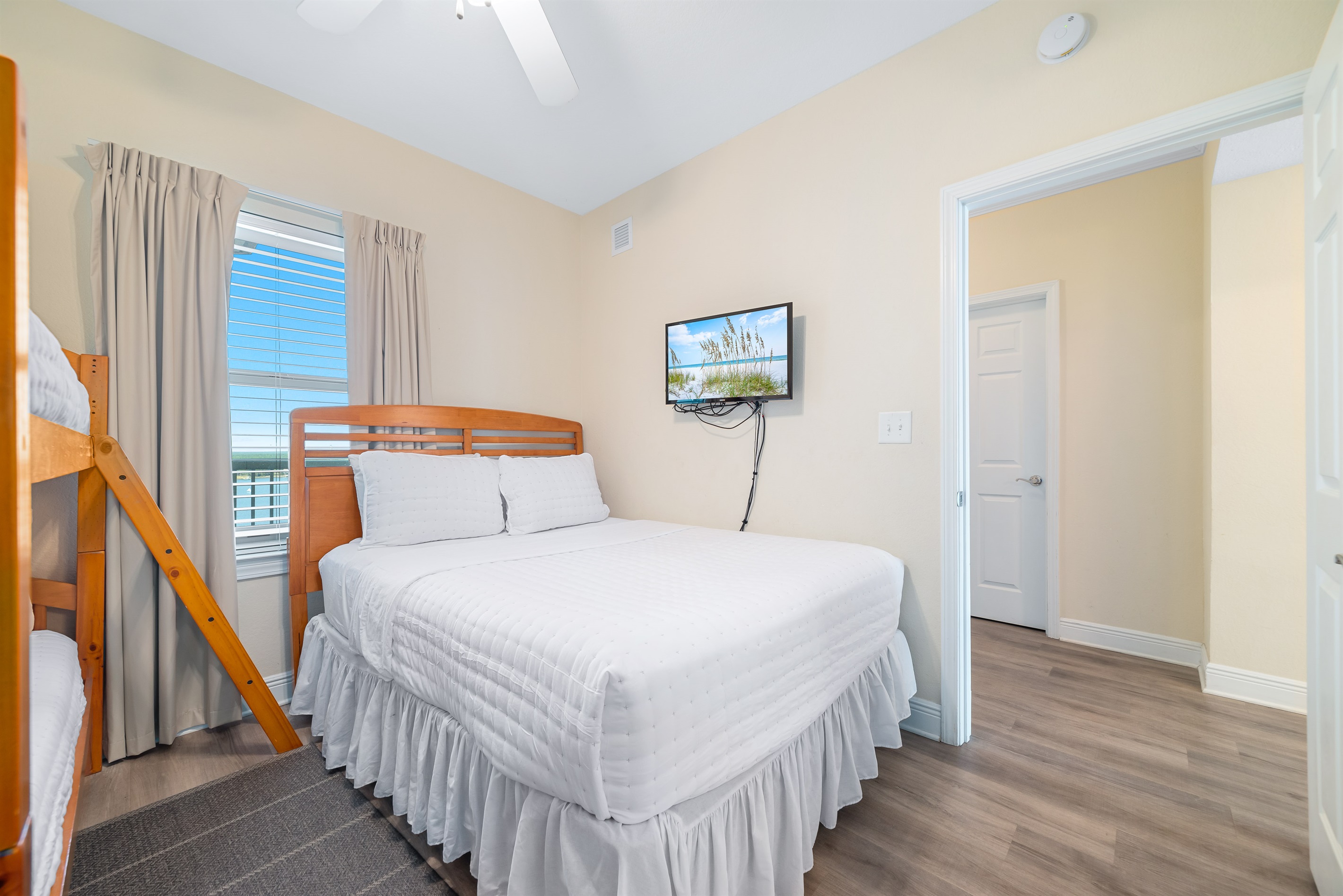 Perfect for families or groups, this guest room with 1 queen-size bed and 1 bunk bed provides a fun and functional space. The thoughtful design ensures comfort and convenience for all.