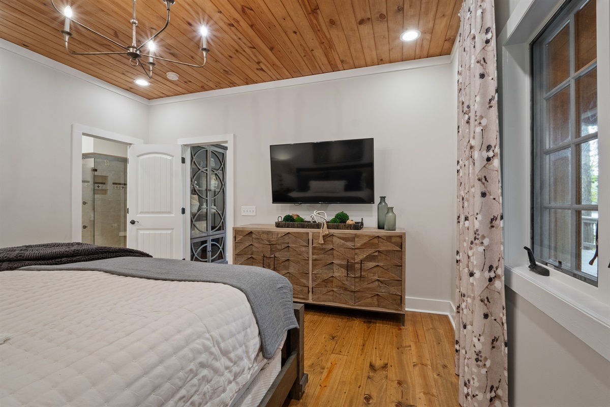 The master suite features a Smart TV, allowing you to unwind with your favorite shows or movies in the comfort of your room.