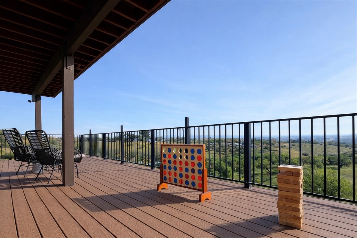 Lower deck with lounge seating and outdoor games