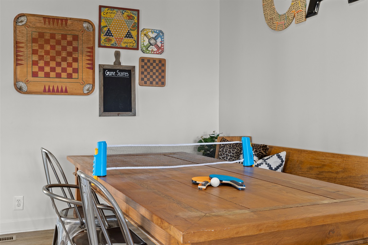 Back living room table an be converted to ping pong table with kit.