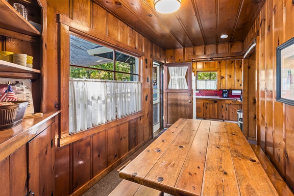 Bright windows and classic cabin woodwork create a cozy, welcoming space for relaxing with your favorite people.