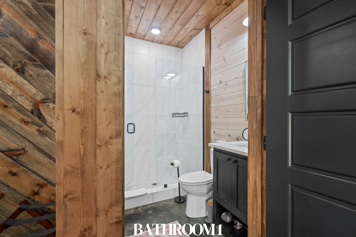 Bathroom 1: Private en-suite with modern finishes and a walk-in shower.