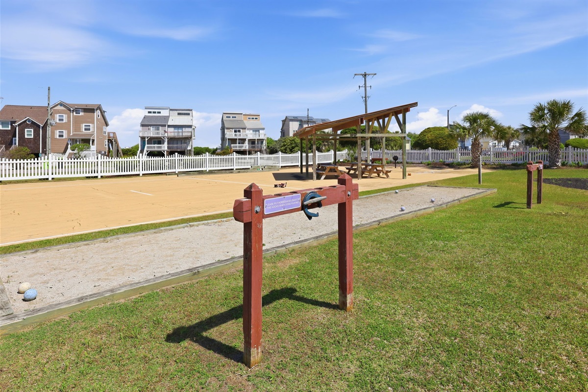 Community recreation space with shuffleboard and picnic seating