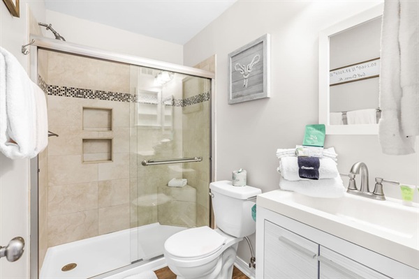 En suite to primary bedroom with walk in shower