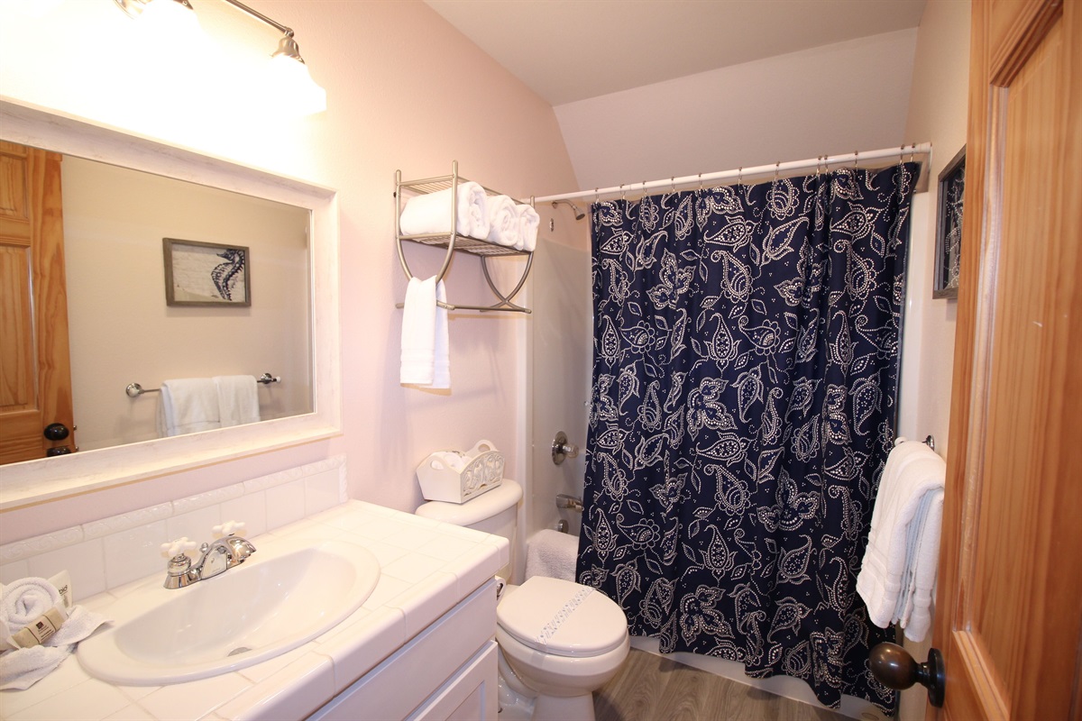 Enjoy easy access to a shared bath, designed for comfort and convenience.