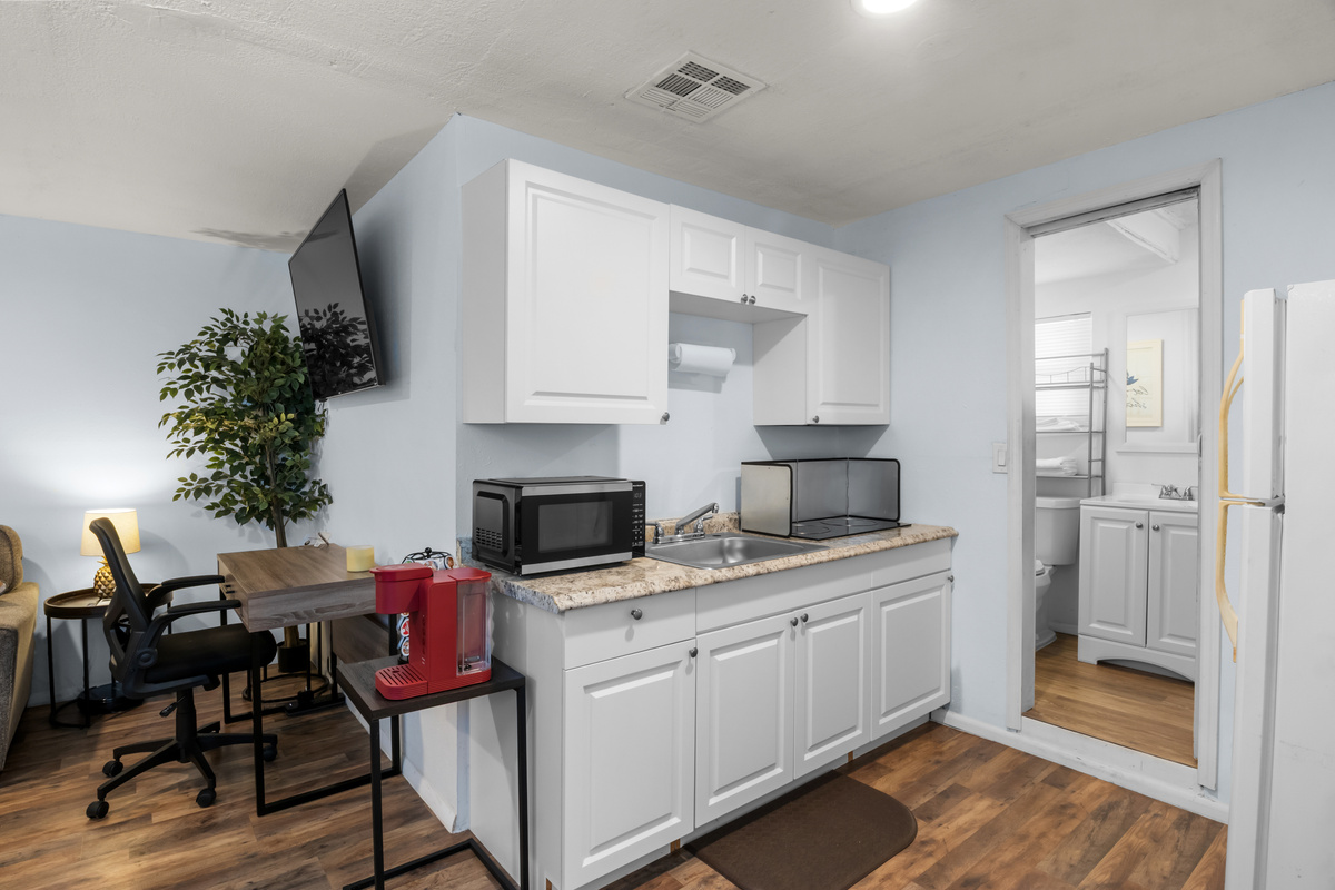 The kitchen connects directly to the bathroom.