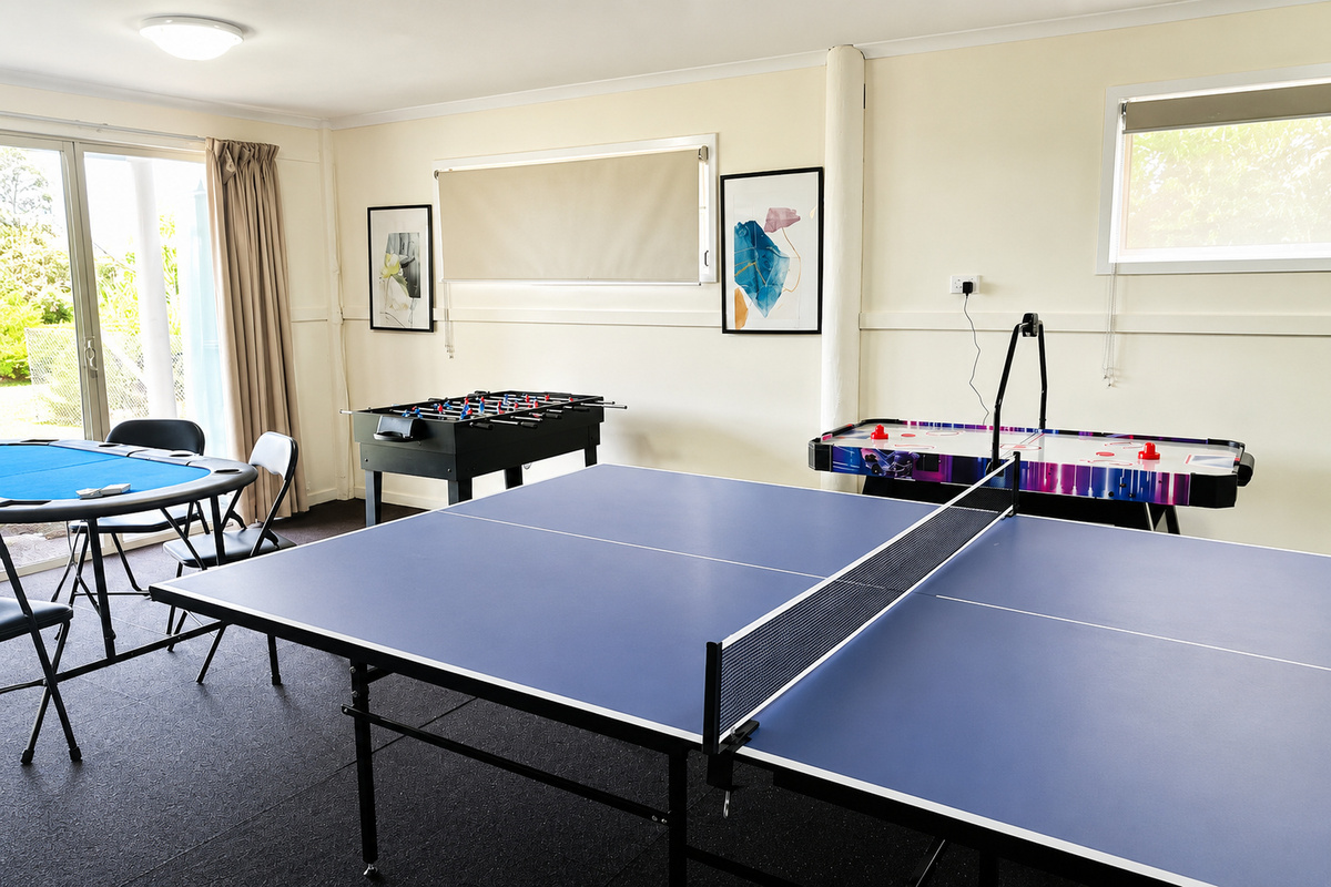 The downstairs games room at Carlenes Getaway adds a fun indoor space with table tennis, air hockey and foosball.