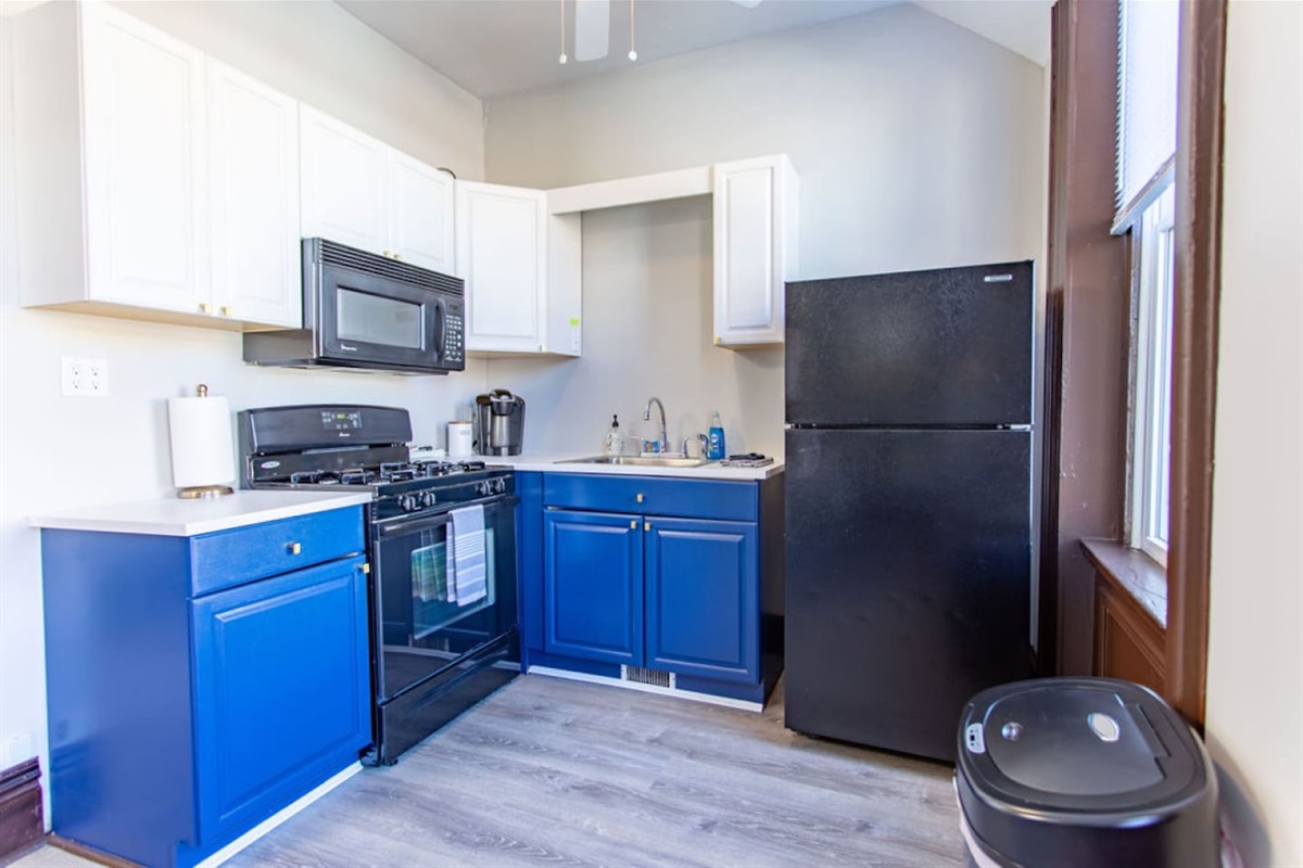 Fully equipped kitchen with modern appliances, cookware, and utensils, ideal for preparing home-cooked meals during your stay.