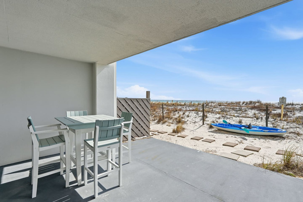 Private patio includes an outdoor pub table that seats 4