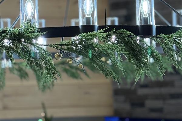 Even the chandelier gets a touch of Christmas! 