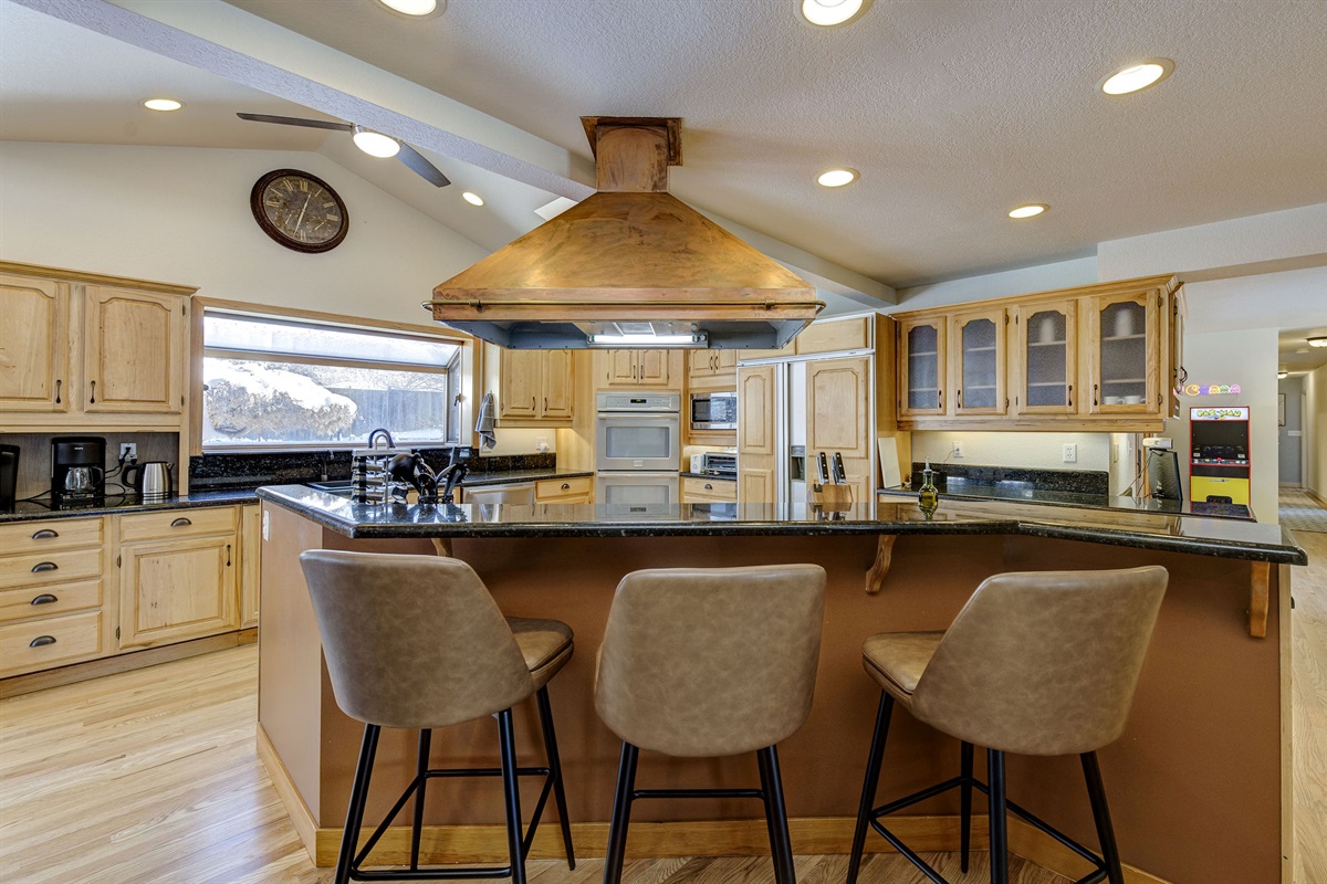 The giant kitchen is perfect for any gathering. Whether you choose to cook or order in, the kitchen is the center hub of this house.