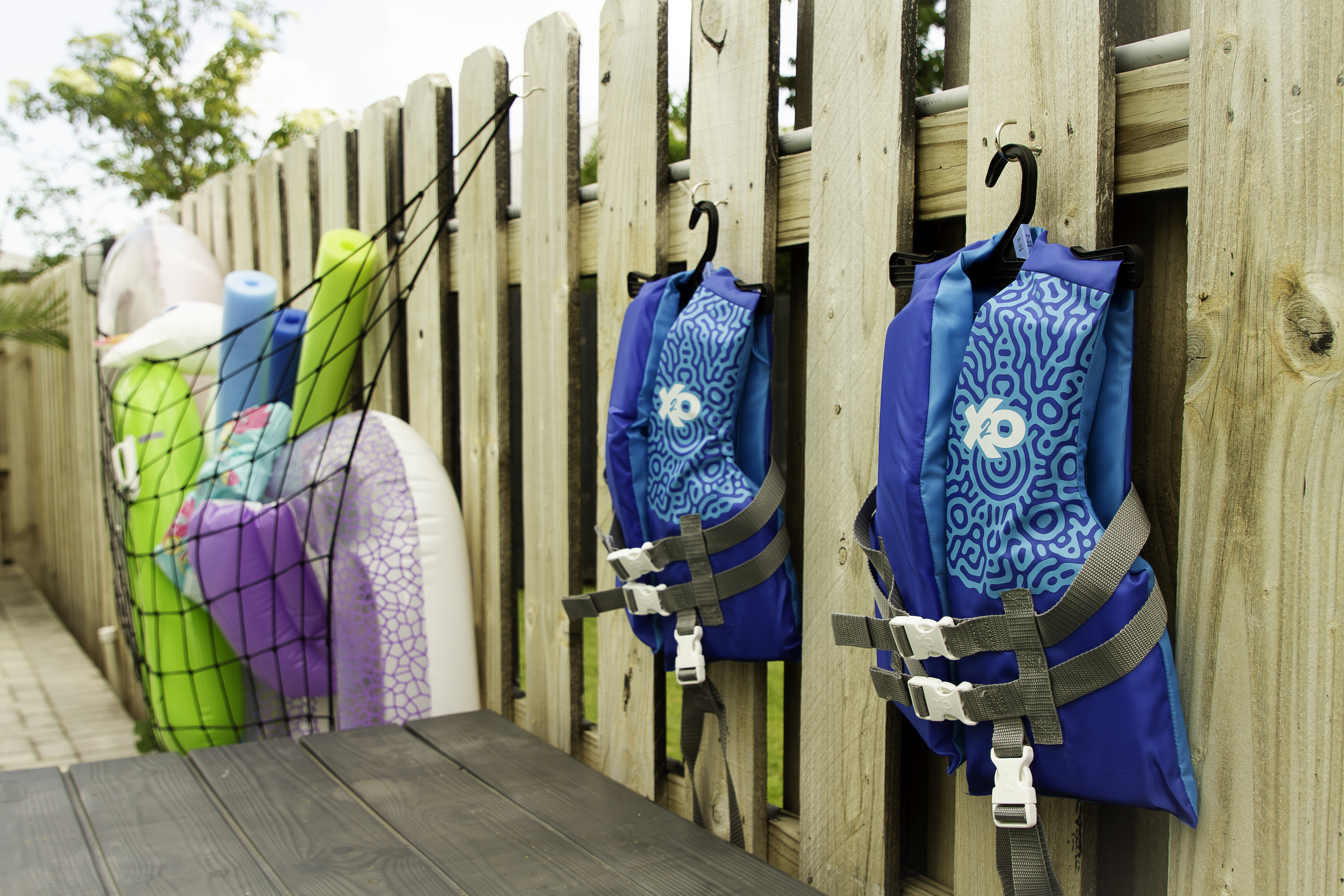 A view of life preservers by the pool