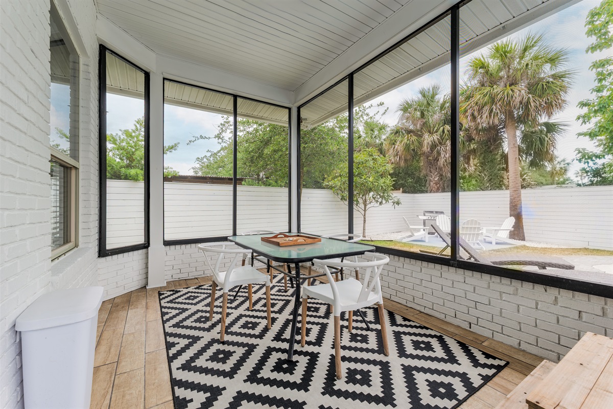Screened-in porch perfection - morning coffee, evening games, or just a peaceful breeze