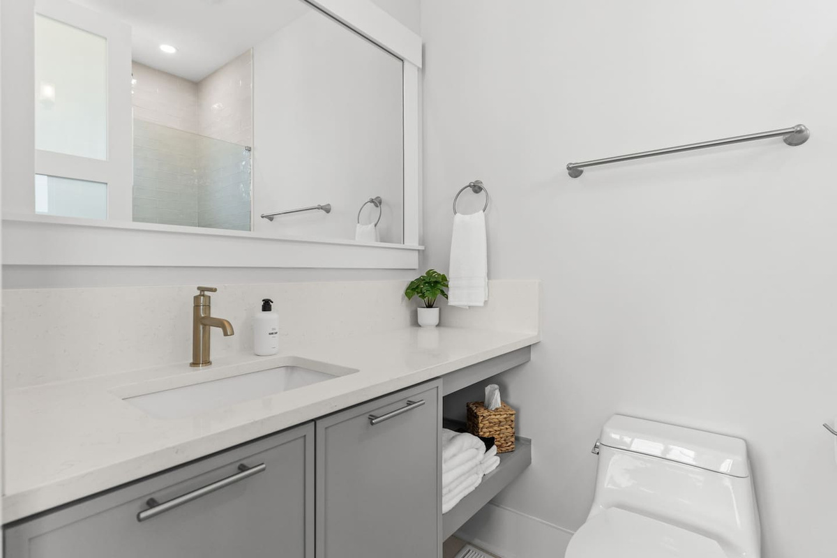 Thoughtful touches make every stay easier. This private en-suite bathroom comes stocked with essentials like hand soap, makeup cloths, tissues, and more.