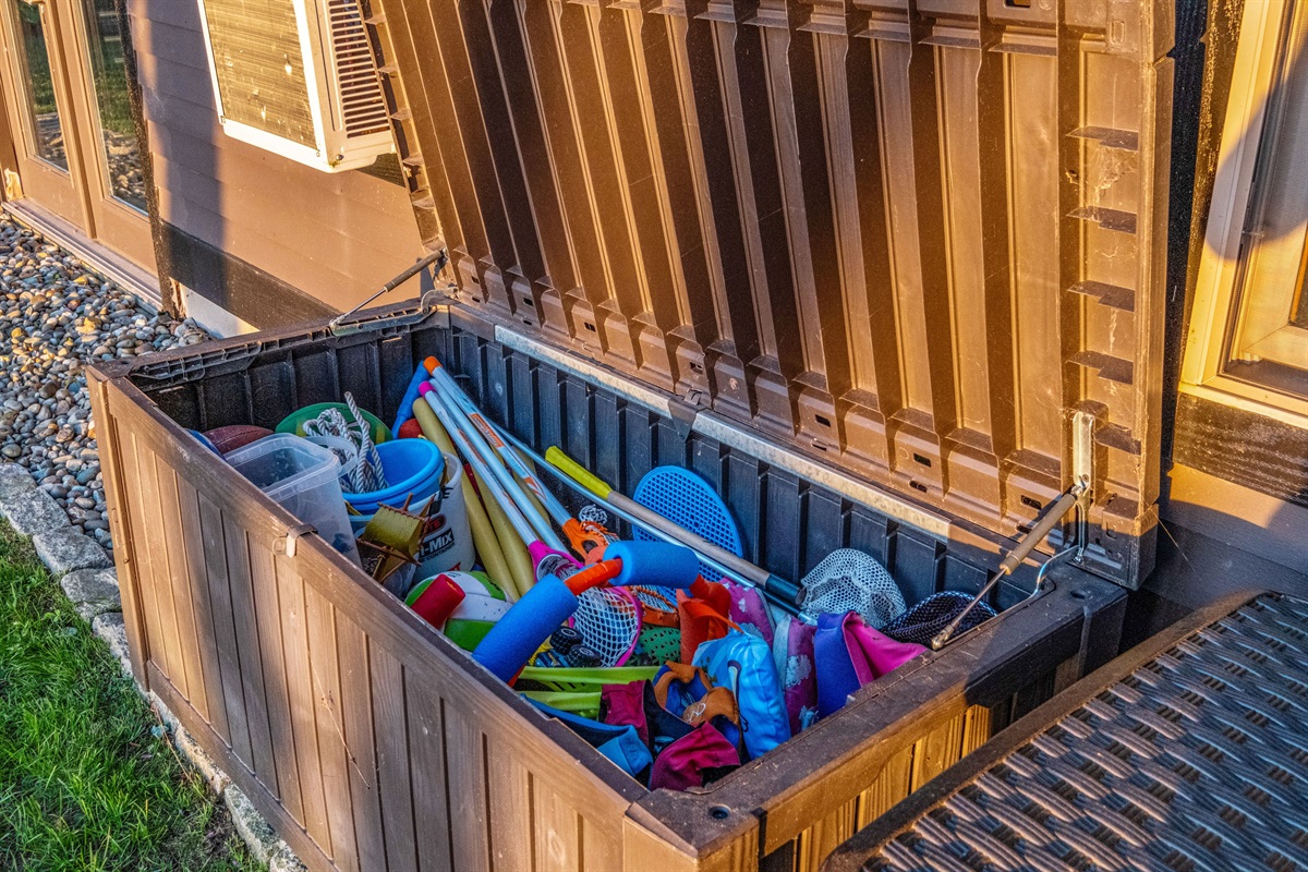 Kids toys for the beach and some small kids life jackets