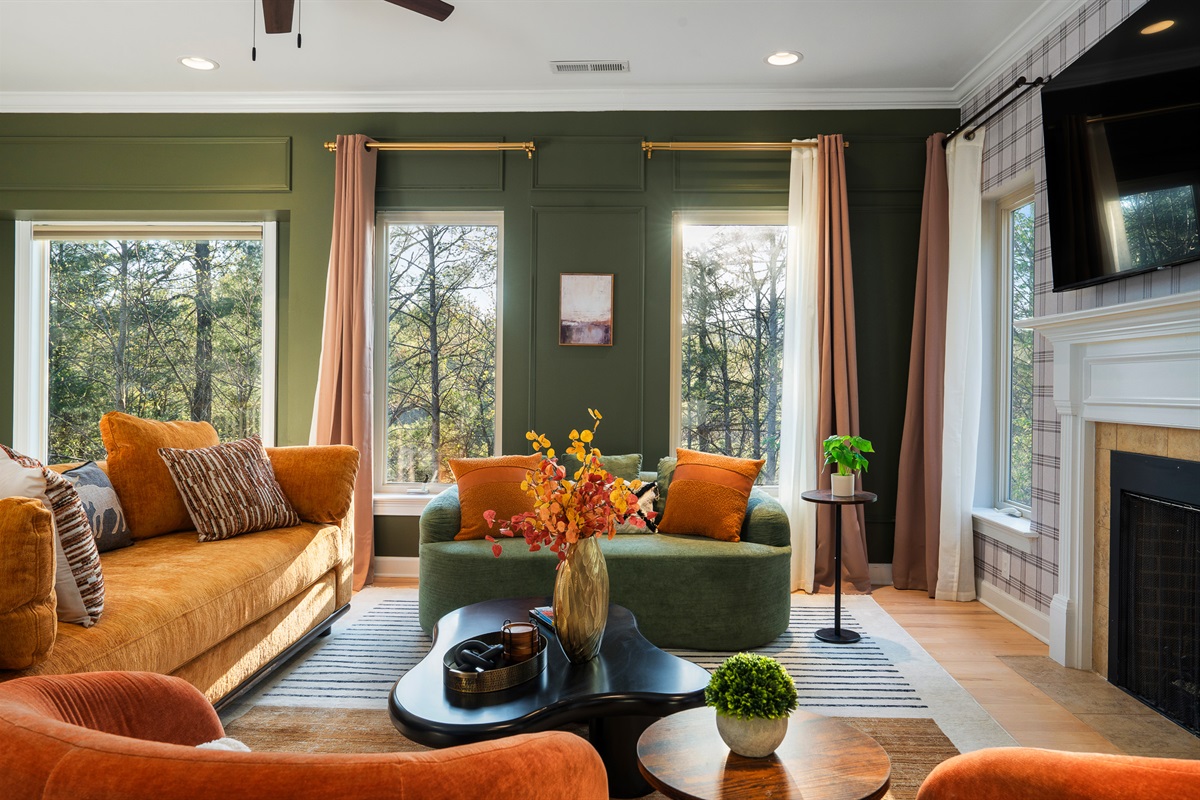 Additional living room with fireplace and seating - multiple spaces to gather without feeling crowded
