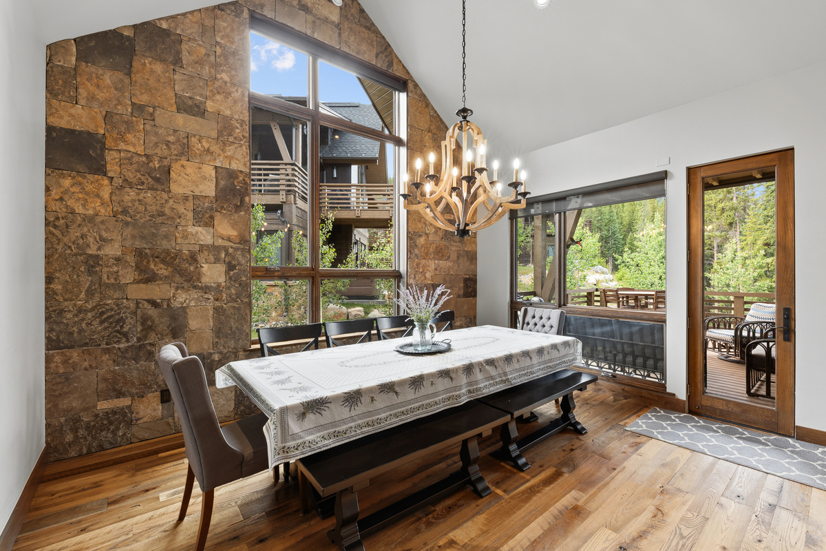 Dining area with seating for 10 and abundant natural light from large windows
