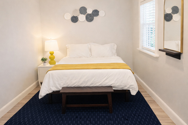 Enjoy added privacy in the detached guest bedroom, located just 10 feet from the main house. This comfortable retreat features a queen bed, Smart TV, and air conditioning, making it the perfect space to relax and unwind while staying close to the rest of y