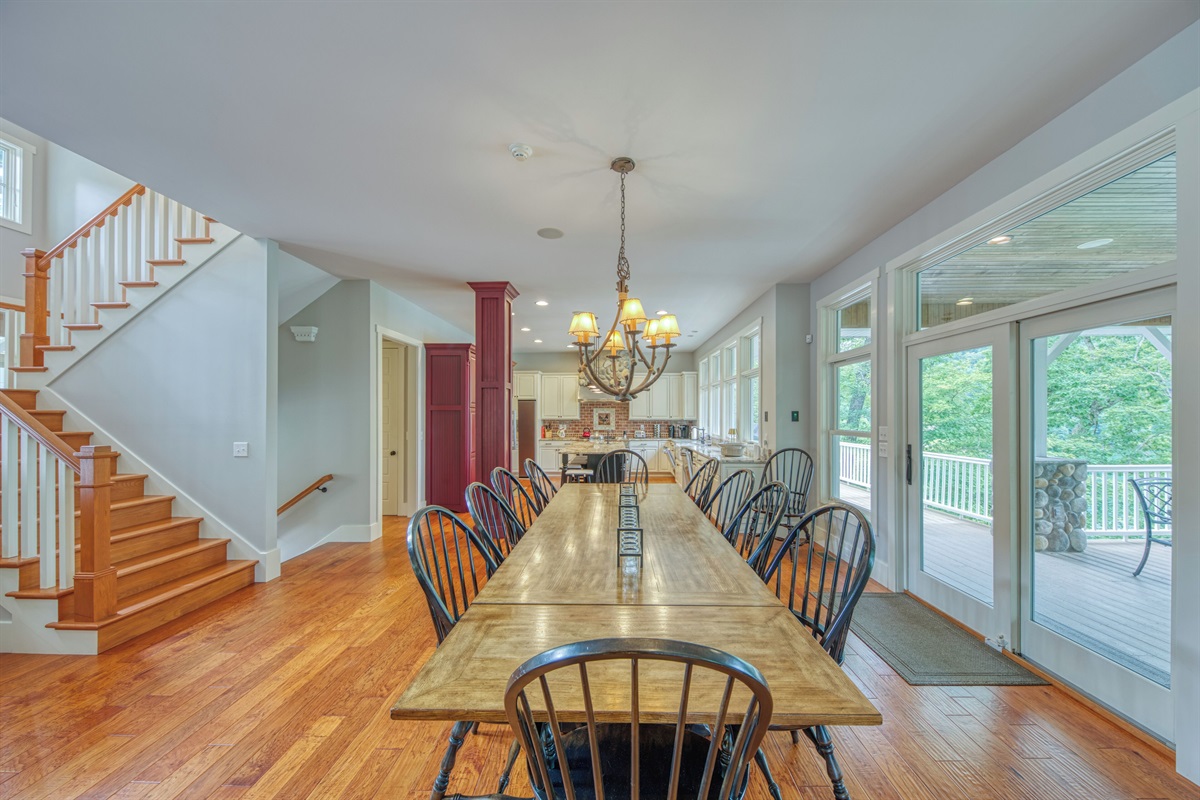 Large Farm Table In Dining Room With Lake Views