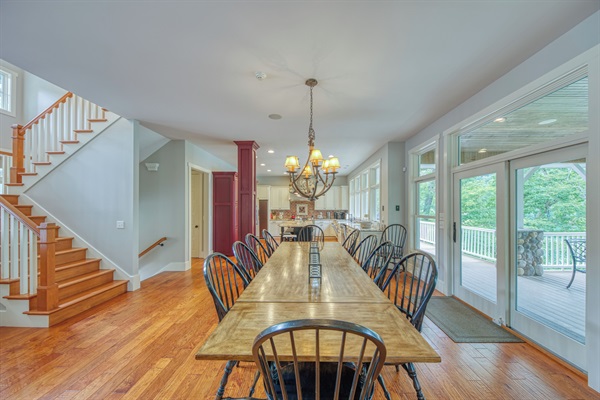 Large Farm Table In Dining Room With Lake Views