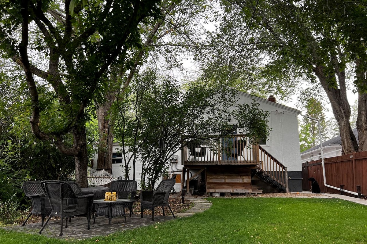 Backyard and showing the back door entrance that the basement suite uses. 