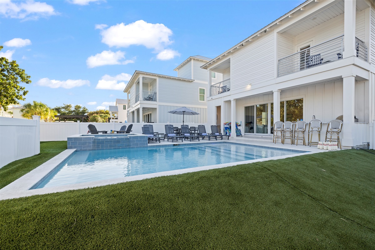 Salt water pool and hot tub with a lounging step