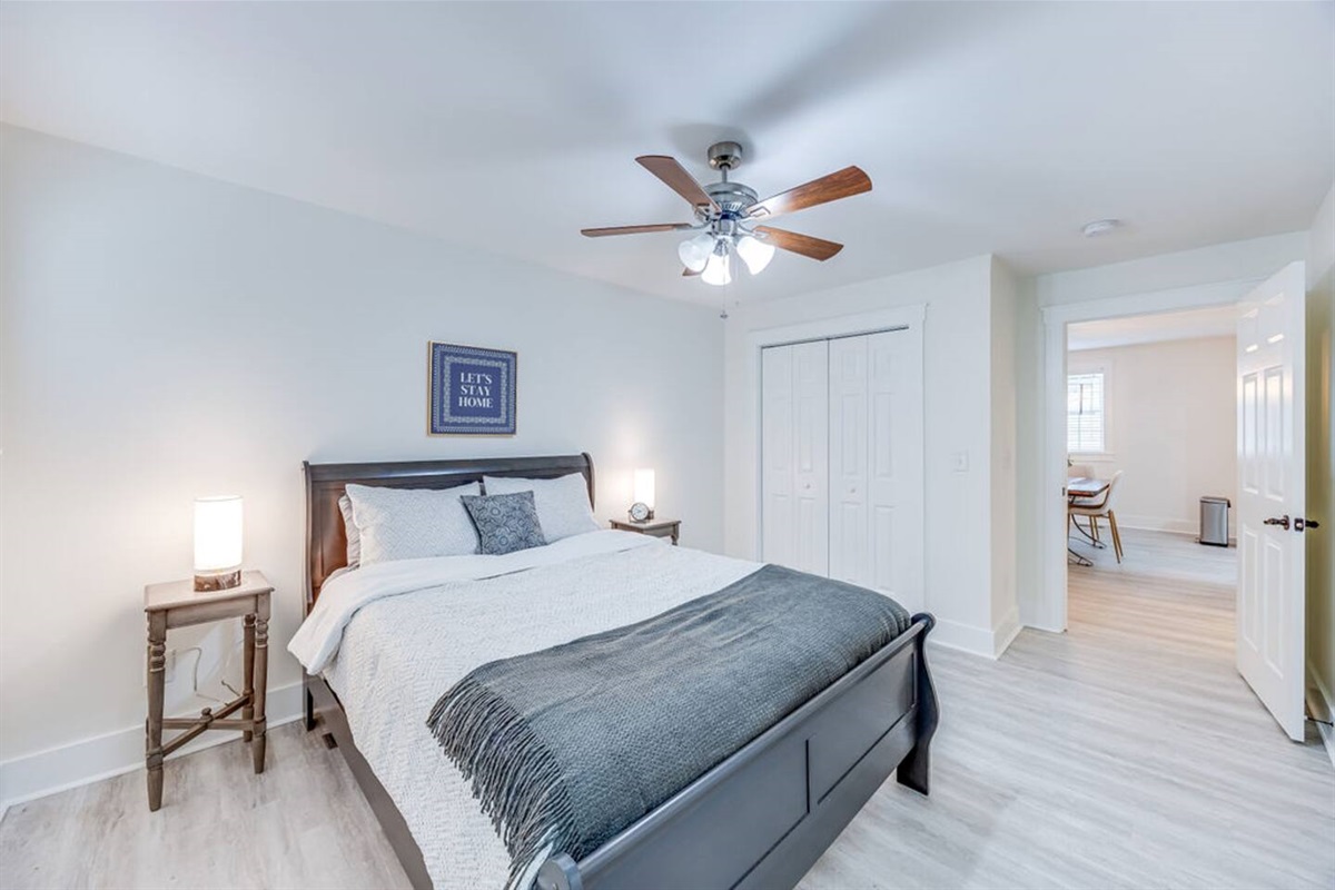 Inviting queen-sized bed, offering the perfect blend of comfort and style for a restful night's sleep.
