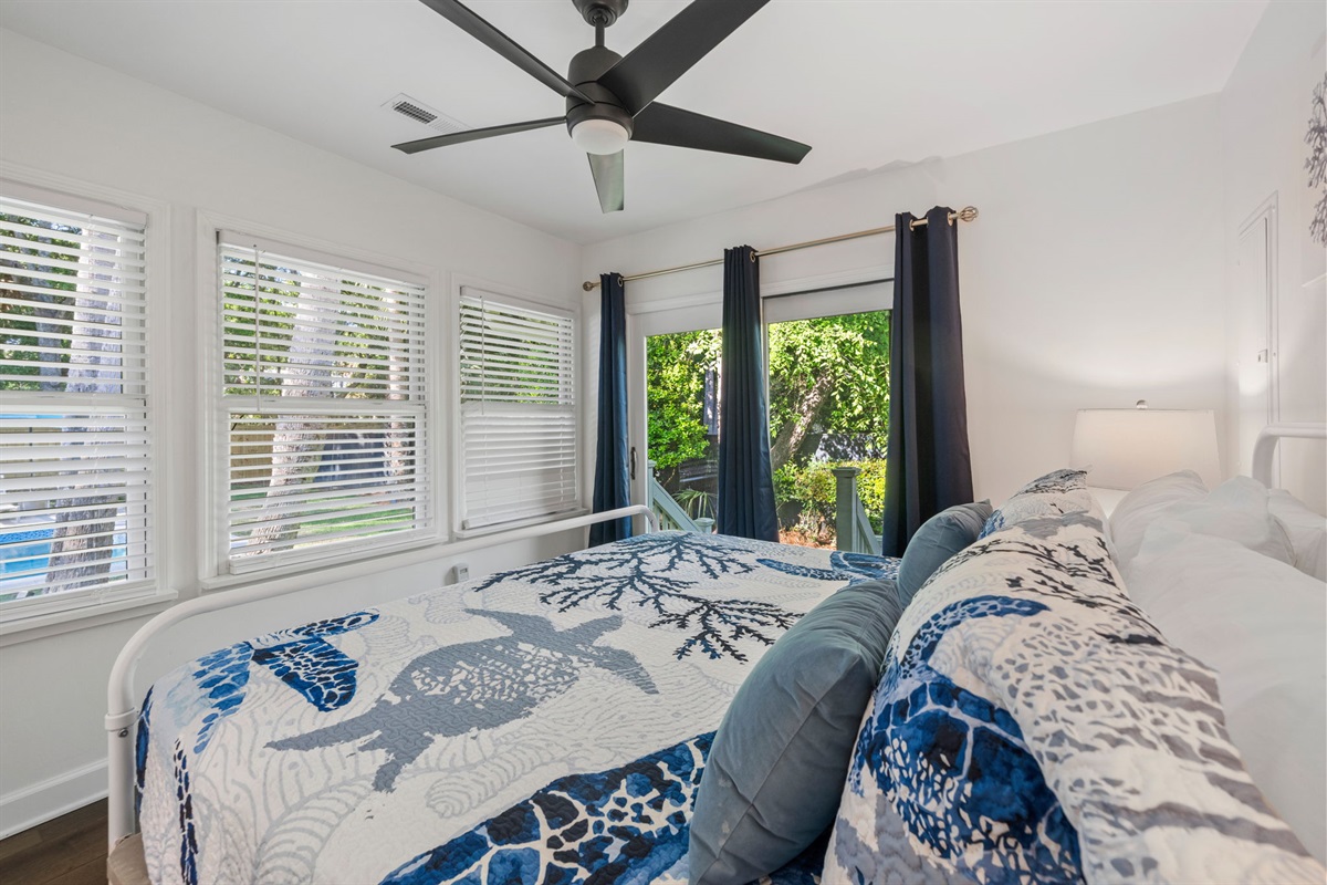 King Bedroom 3 Overlooks The Pool and Has a Private Entrance To Backyard | IOP Escapes Beach Blessing | 3705 Hartnett Blvd, Isle of Palms, SC