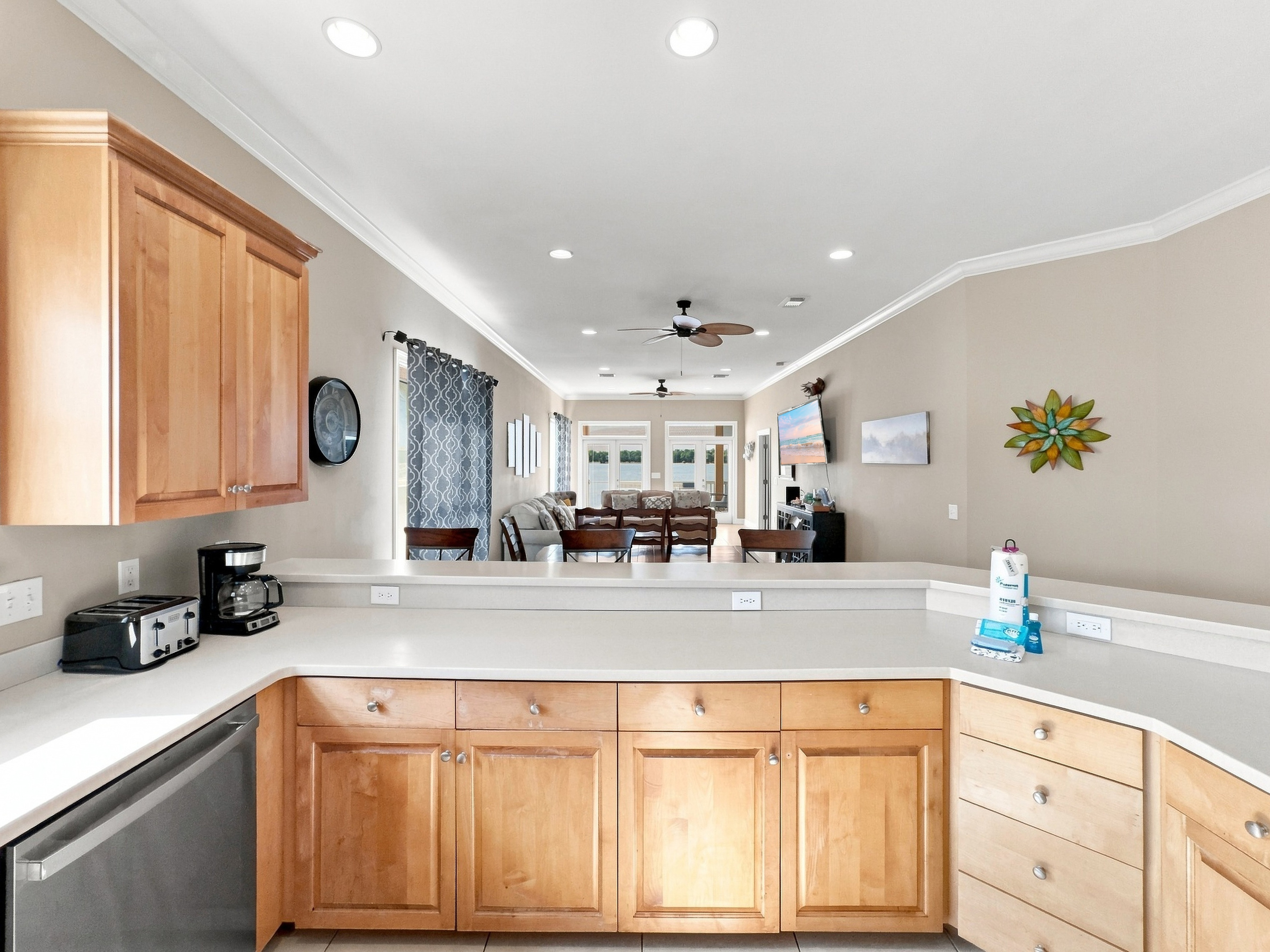 Open kitchen with breakfast bar flowing into the living space