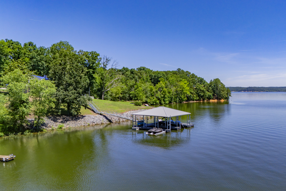A wide drone view highlights the private covered dock and The View’s open-water location on Kentucky Lake.