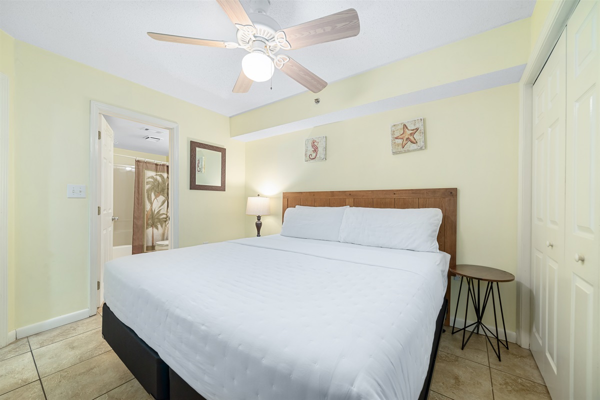 Light and airy bedroom with a classic white palette and elegant furnishings, creating a calming atmosphere.