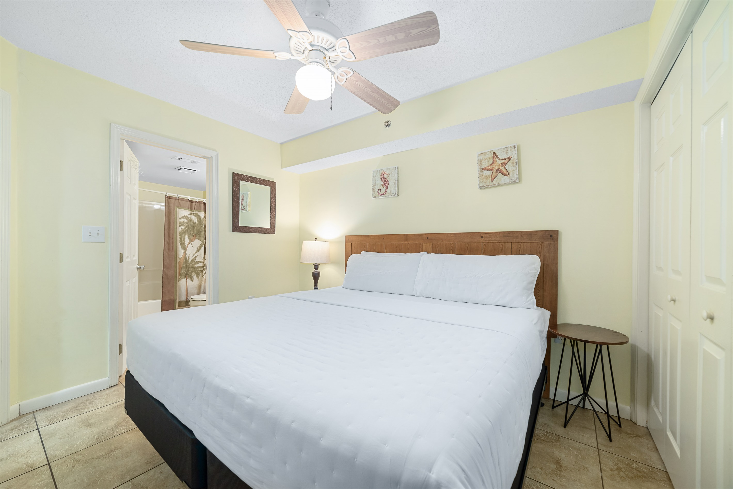 Light and airy bedroom with a classic white palette and elegant furnishings, creating a calming atmosphere.