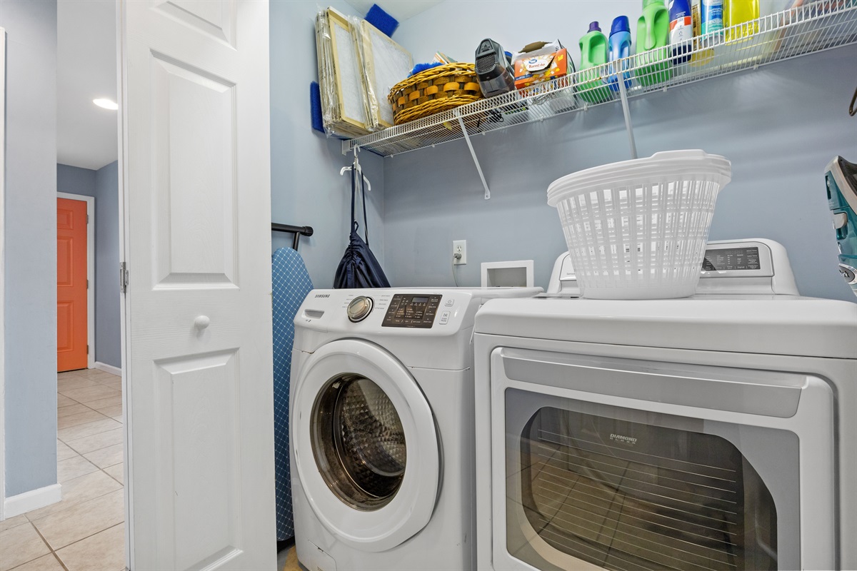 In-unit washer and dryer with convenient shelving for easy laundry days